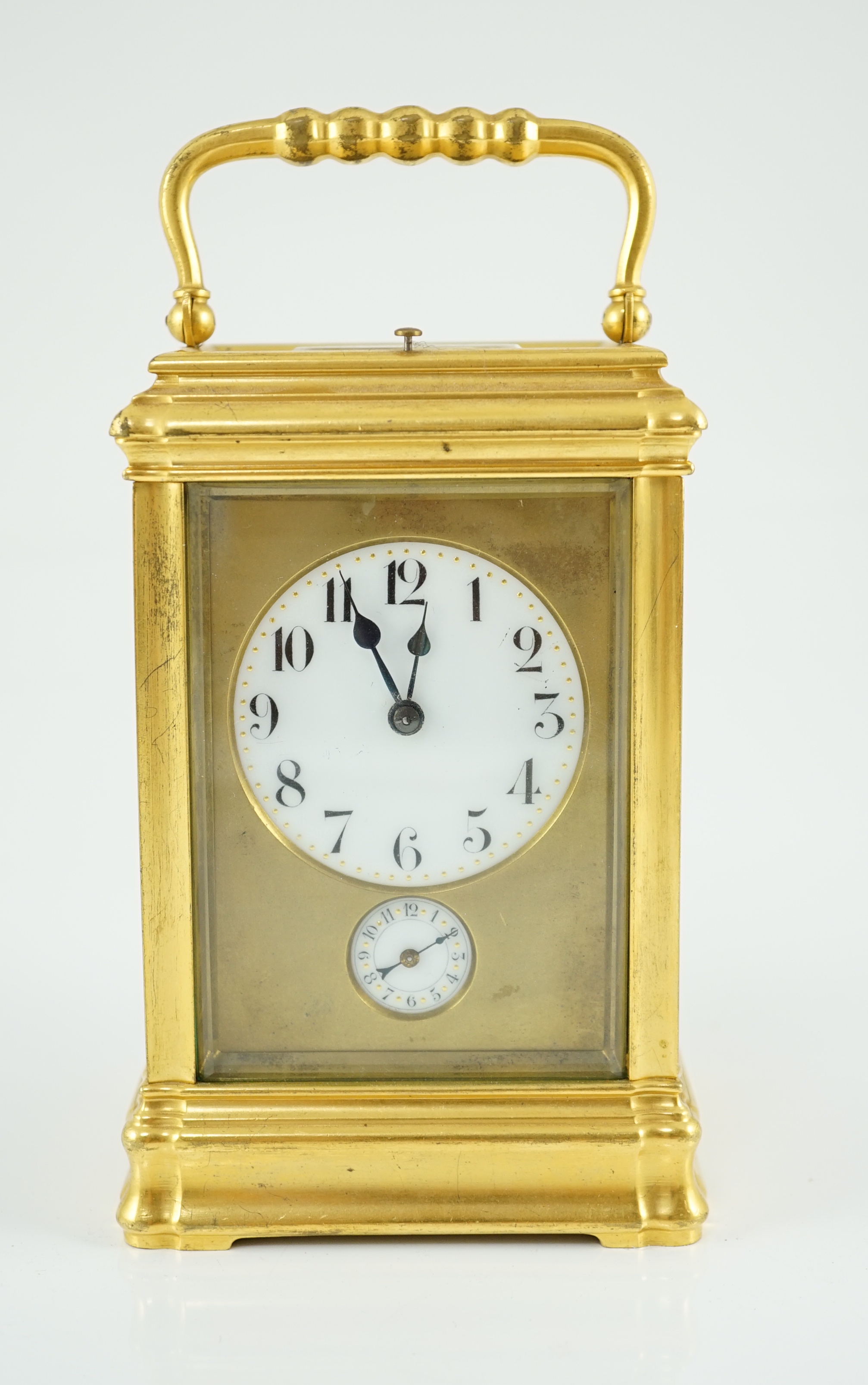An early 20th century French ormolu Grande Sonnerie alarum clock, with enamelled Arabic dials and gorge case, movement striking on two blued steel gongs, 10cm wide, 9cm deep, 15.5cm high